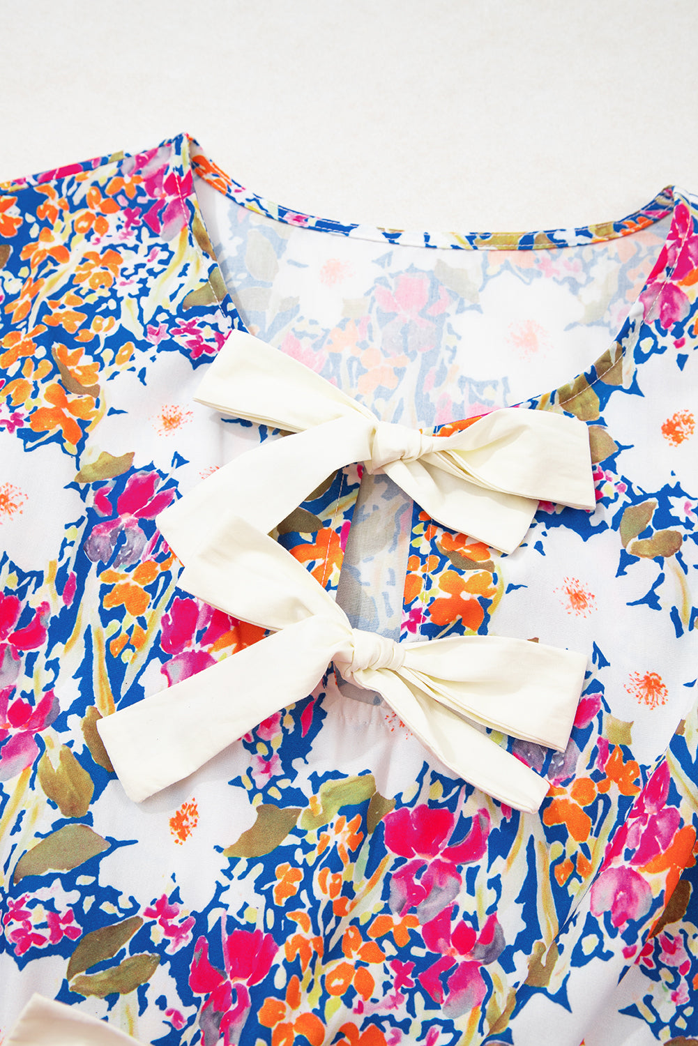 Green Floral Print Bow Applique Slit Sleeveless Peplum Blouse