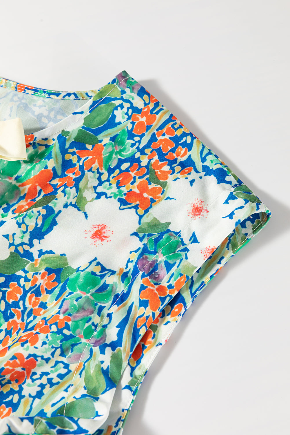 Green Floral Print Bow Applique Slit Sleeveless Peplum Blouse